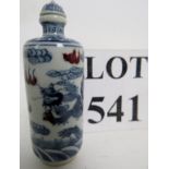 A Chinese porcelain snuff bottle and dom