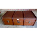 An early 20th century tan trunk with woo