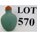 A Chinese Celadon glazed snuff bottle wi