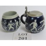 Two German beer steins with footballers