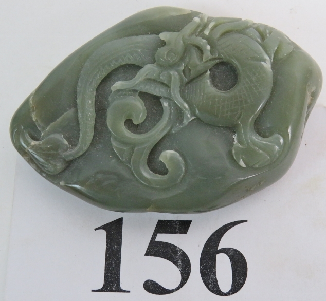 A Chinese carved Jade boulder, decorated