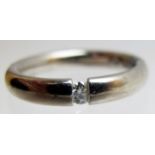 An 18ct white gold ring, with inset cent