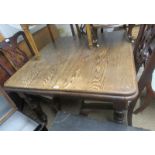 A Victorian oak wind out dining table, w