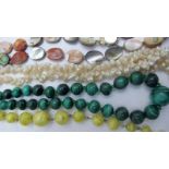 A malachite necklace, an abalone shell n