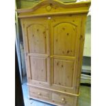 A 20th century pine double wardrobe with