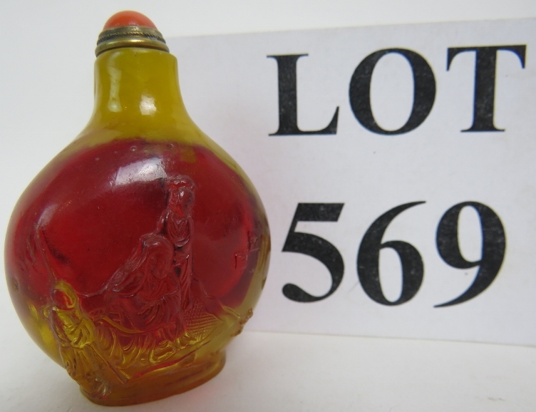 A Chinese amber coloured snuff bottle an