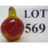 A Chinese amber coloured snuff bottle an