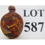 A Chinese erotic snuff bottle and stoppe