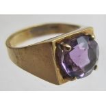 A 9ct gold ring set with centre amethyst