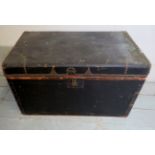 A vintage travelling trunk with brass st