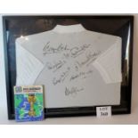 A framed shirt signed by seven members o