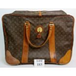 A Louis Vuitton travel case, 65cm wide,