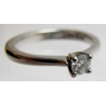 A diamond solitaire platinum ring, appro