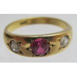 An 18ct gold ruby and diamond gypsy ring
