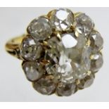 A diamond cluster ring set with old cut diamonds, the centre diamond approx 1.