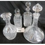 Four 20th Century cut glass decanters, a ship's decanter,