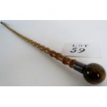 An antique bamboo walking stick with Tigers Eye onyx handle and metal collar, 89cm long,