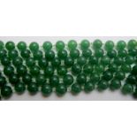 Fine jade bead necklace, 60" length, individually knotted beads of even size and colour,