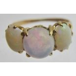 An 18ct gold three stone opal ring, size M,