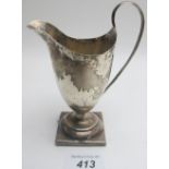 A Georgian silver helmet shaped jug, London 1786, (slightly a/f),