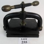 Heavy duty cast iron book press with brass fittings, 31cm tall, weighs a considerable amount,