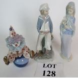 Three Lladro figures, Clown on Ball, Boy with Sailboat (original box) and Madonna with Lilies (A/F),