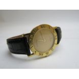 A fine quality Corum Swiss made 18ct gold cased wristwatch, 'Romvlvs', with black leather strap,
