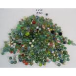 A large quantity of glass marbles, mainly with cat's eye coloured glass insets,