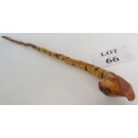 A well carved natural form walking stick, in probably blackthorn, with foliate decoration,