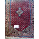 A Saraband, mid 20th century rug, overall paisley & shikari border, double wefted,
