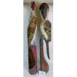 Two large wooden models of birds with painted and fabric decoration,