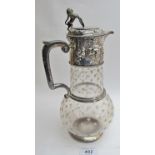 A Victorian silver mounted glass claret jug,