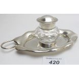 A silver inkwell, well base in the shape of a leaf, London 1902, with unmarked glass ink pot,