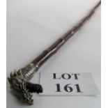 A staff with cast metal dragon handle and natural bark finish shaft, brass ferrule, 125cm long,
