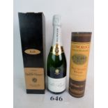 Excellent mixed Christmas Lot comprising 1 bottle of Pol Roger Reserve, 1 boxed bottle of Quien X.