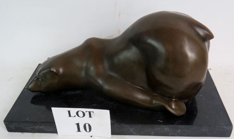 A stylish contemporary bronze sculpture modelled as a bear in comical pose, on marble plinth base,