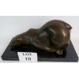 A stylish contemporary bronze sculpture modelled as a bear in comical pose, on marble plinth base,