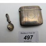 A silver vesta case and a silver napkin holder, both fully hallmarked,