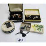 A collection of five pairs of cuff links, to include a vintage car pair,