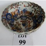 An antique Oriental bowl decorated with figures in a garden setting with gilt overglazed highlights.