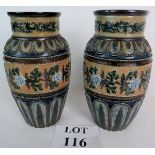 A pair of Doulton Lambeth 19th century vases, decorated with raised geometric and floral patterns,