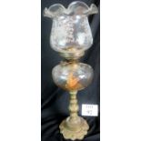 A Victorian oil lamp of large proportions with glass central reservoir and frosted glass shade in a