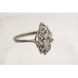 An unmarked white metal diamond cluster ring, size P,