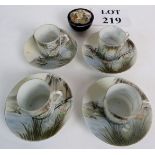 Four Noritake coffee cans and saucers in eggshell porcelain decorated with an oriental landscape