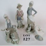 Four Lladro figures: girl with dove, girl with a goose, a fisher boy and a single goose.