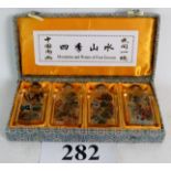 A Chinese cased set of 4 `inside painted' glass snuff bottles,