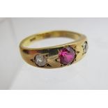 An 18ct gold ruby and diamond gypsy ring, size L,