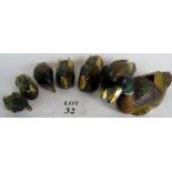 A collection of hand painted wooden ducks in graduated sizes, seven ducks, largest 29cm long,
