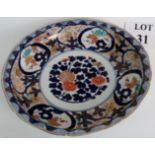 19th century Imari dish with old staple repair, decorated in blues,