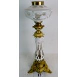 A good quality 19th century Bohemian opaque-flashed glass oil lamp with lavish gilt metal mounts,